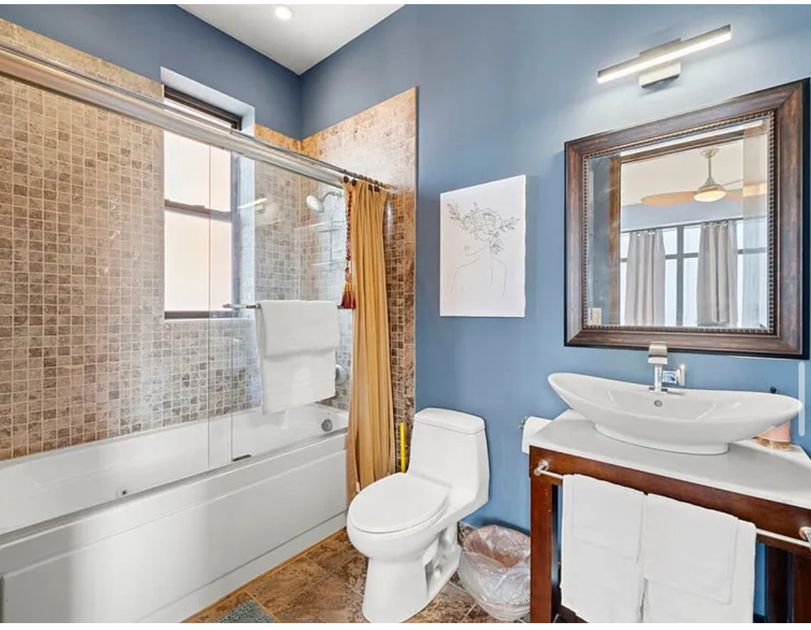 Undisclosed Address Chicago, IL 60608 - Photo 22 of 46 a bathroom with a sink toilet and shower