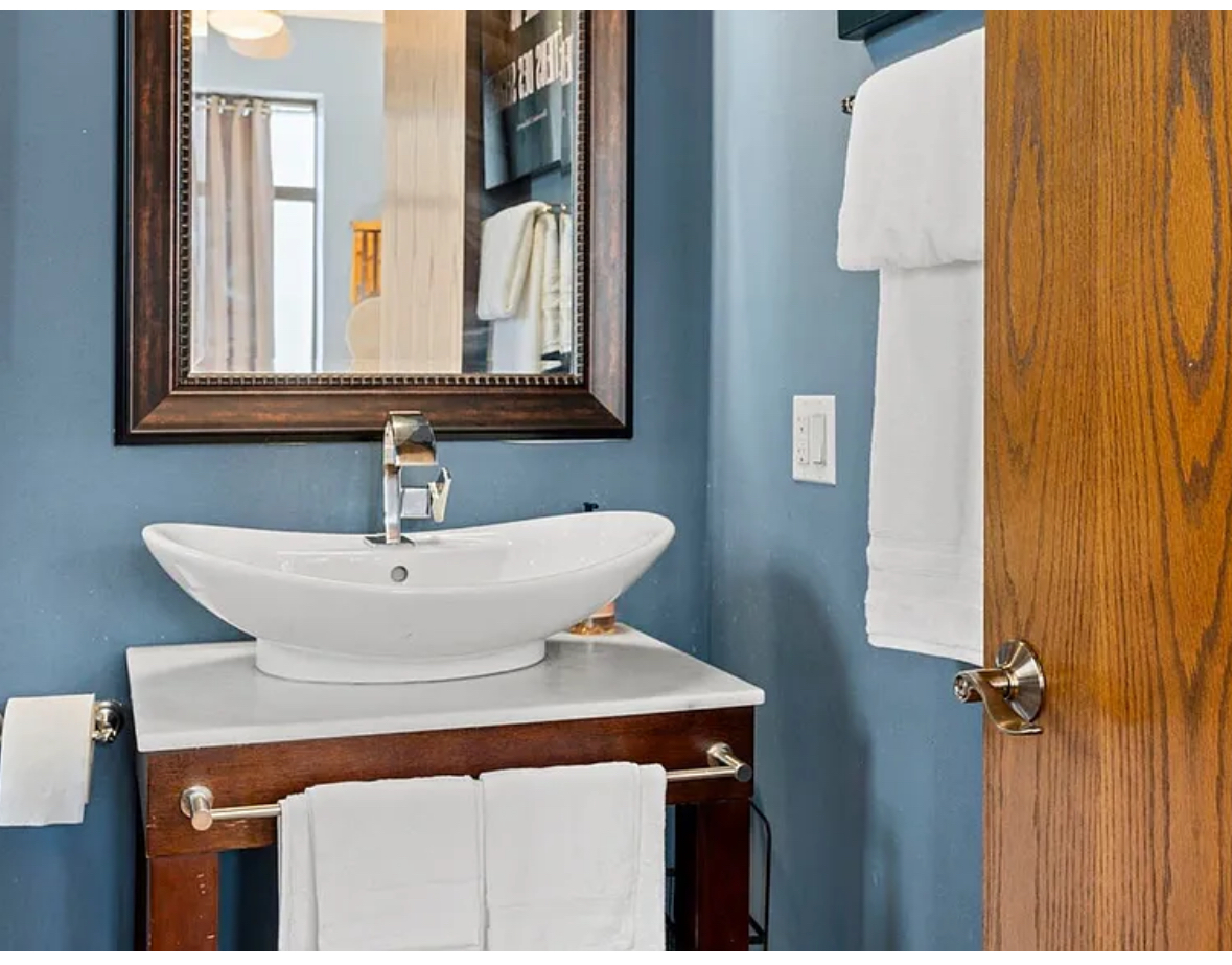 Undisclosed Address Chicago, IL 60608 - Photo 23 of 46 a bathroom with a sink and a mirror