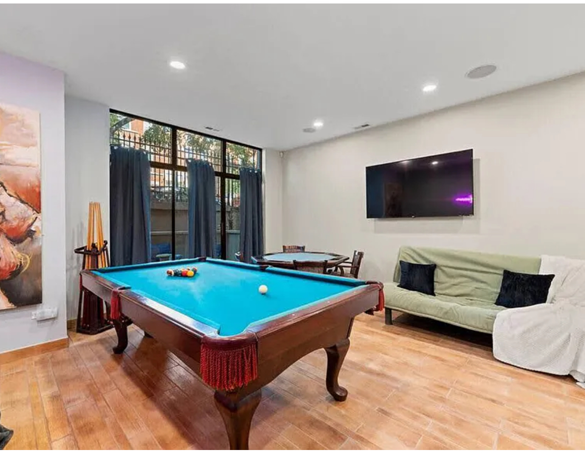 Undisclosed Address Chicago, IL 60608 - Photo 25 of 46 a living room with furniture and a flat screen tv