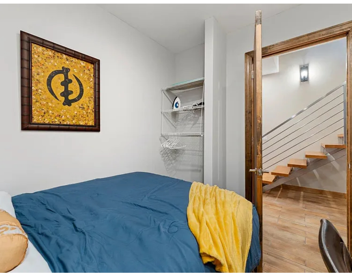Undisclosed Address Chicago, IL 60608 - Photo 27 of 46 a view of a bedroom with wooden floor and a bathroom