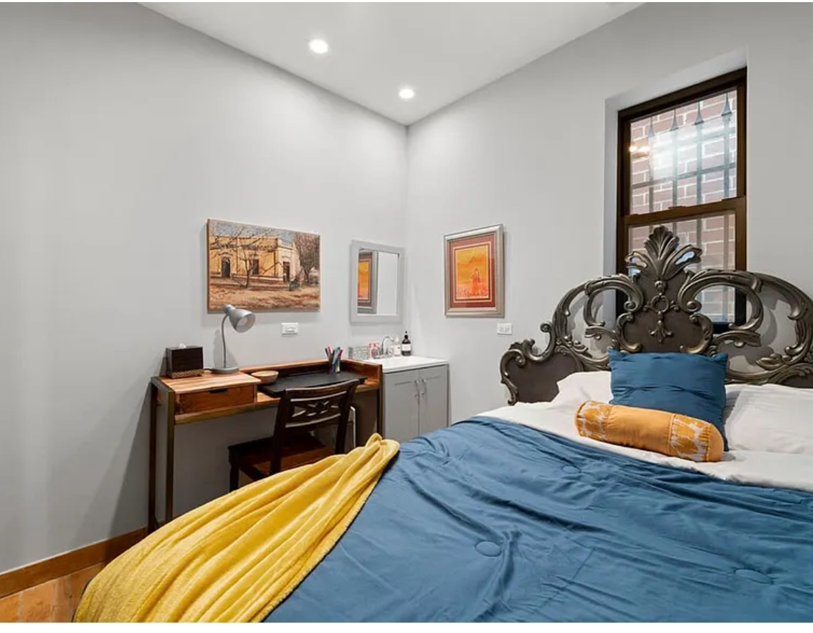 Undisclosed Address Chicago, IL 60608 - Photo 29 of 46 a bedroom with furniture and wooden floor