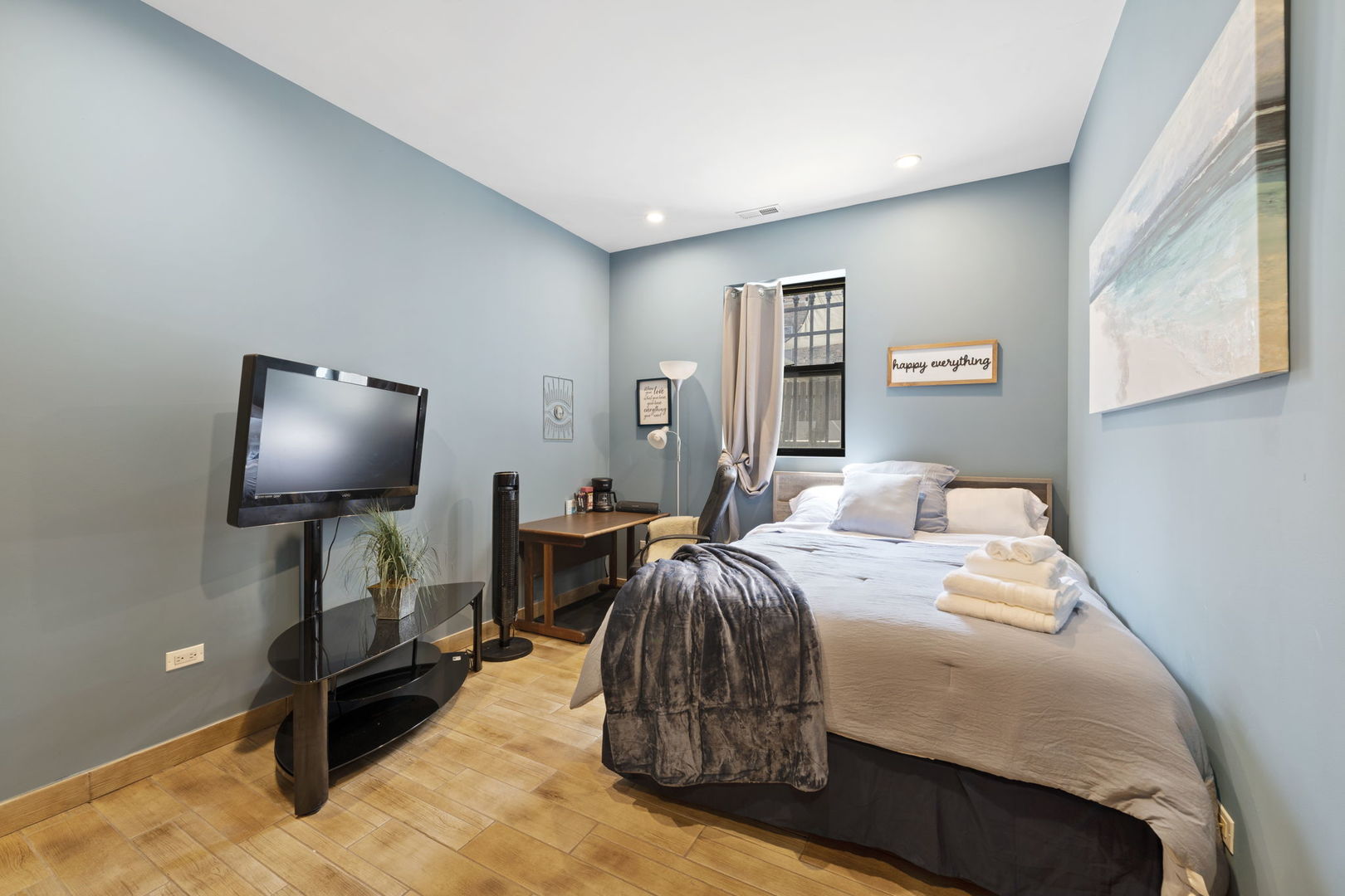 Undisclosed Address Chicago, IL 60608 - Photo 34 of 46 a bedroom with a bed and a flat screen tv