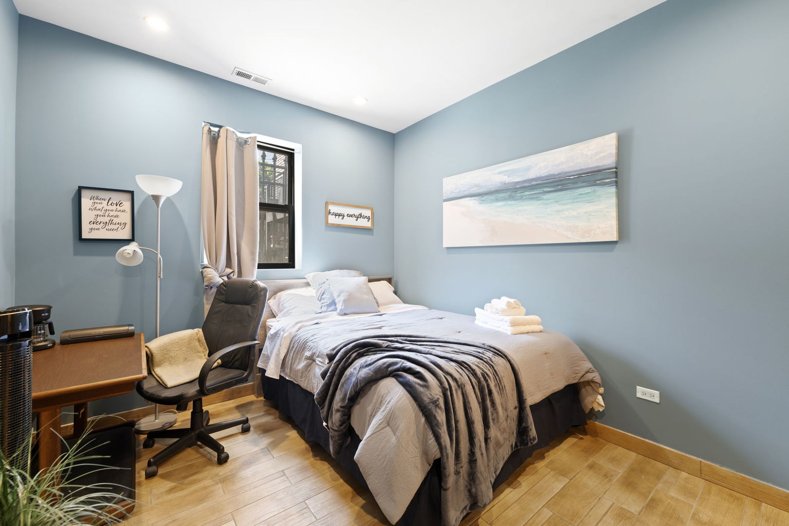 Undisclosed Address Chicago, IL 60608 - Photo 35 of 46 a bedroom with a bed and chair