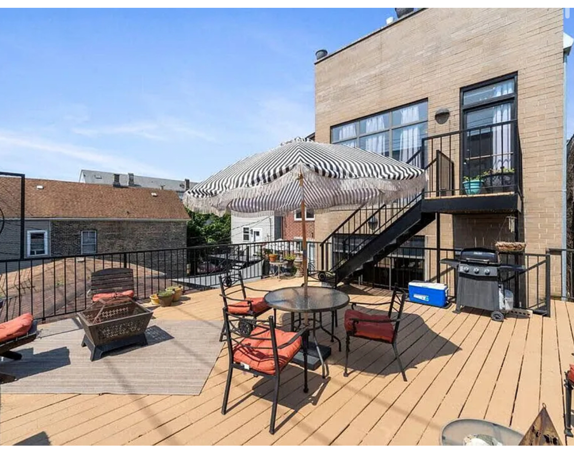 Undisclosed Address Chicago, IL 60608 - Photo 36 of 46 a roof deck with table and chairs