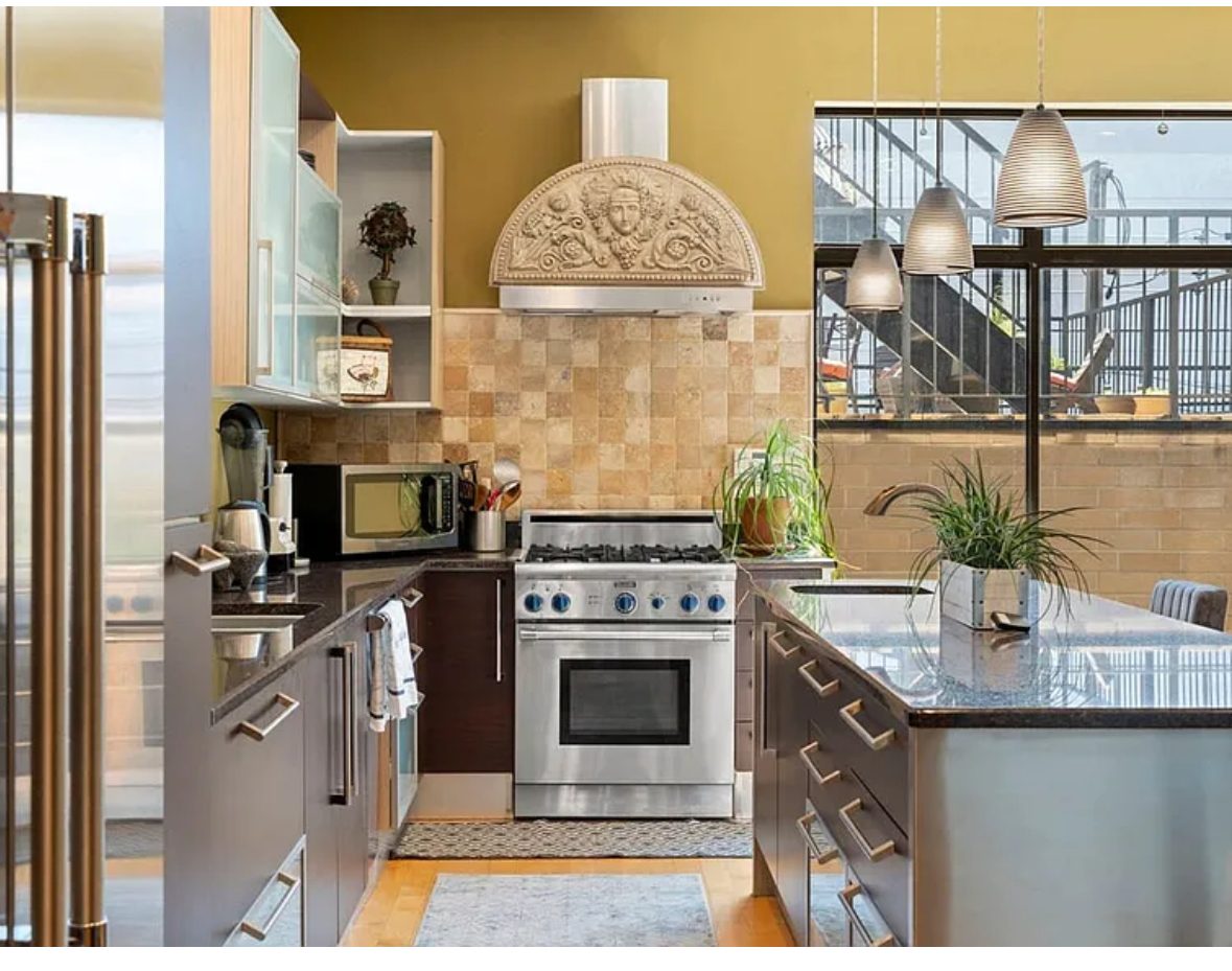 Undisclosed Address Chicago, IL 60608 - Photo 7 of 46 a kitchen with stainless steel appliances granite countertop a stove and more cabinets