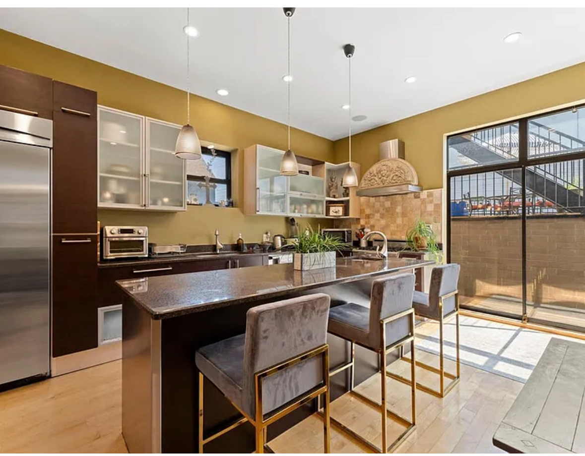 Undisclosed Address Chicago, IL 60608 - Photo 8 of 46 a kitchen with stainless steel appliances granite countertop a sink and a refrigerator