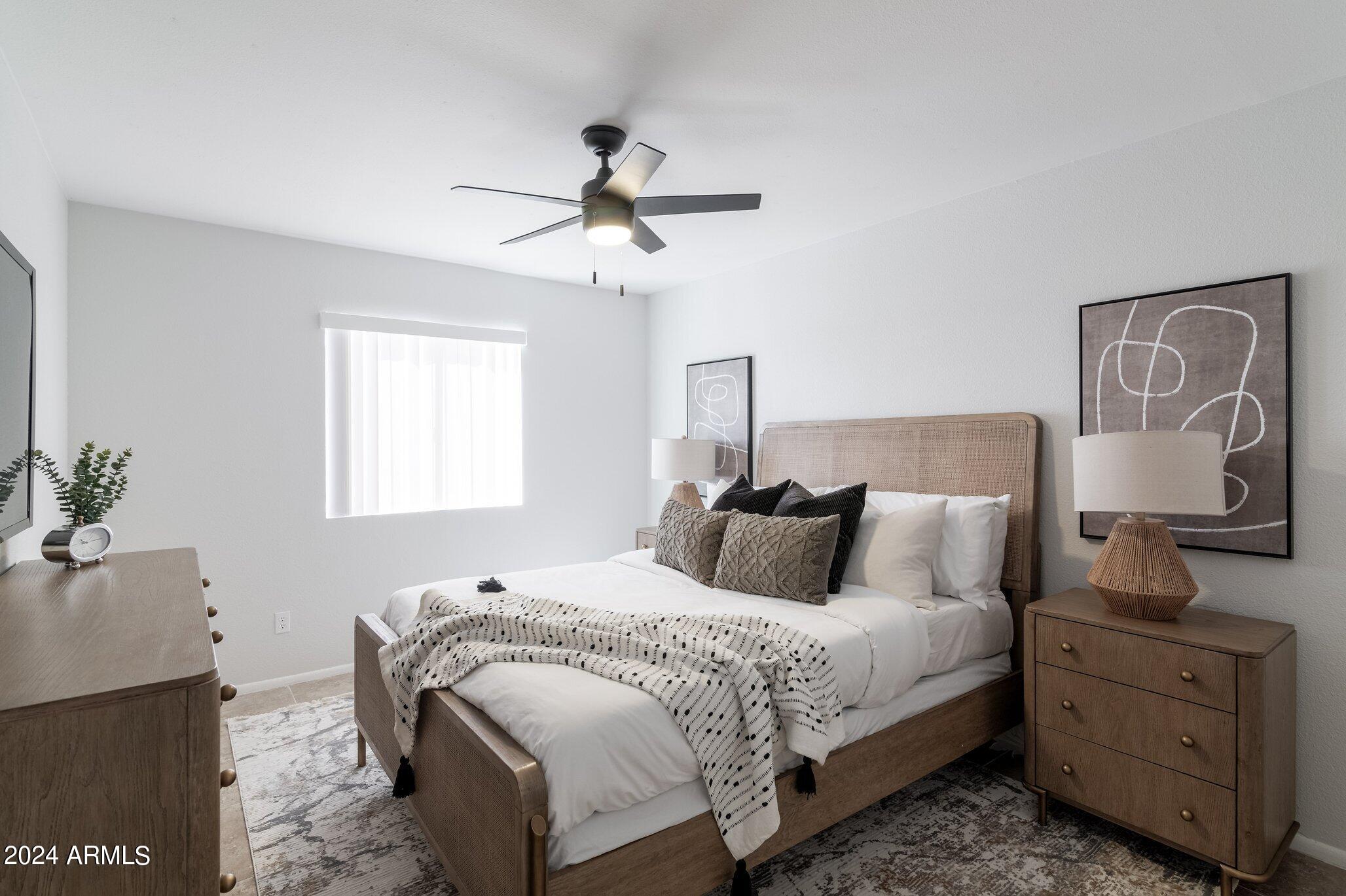 1615 North 51st Street, Unit 5 Phoenix, AZ 85008 - Photo 11 of 18 a bedroom with a bed and a potted plant