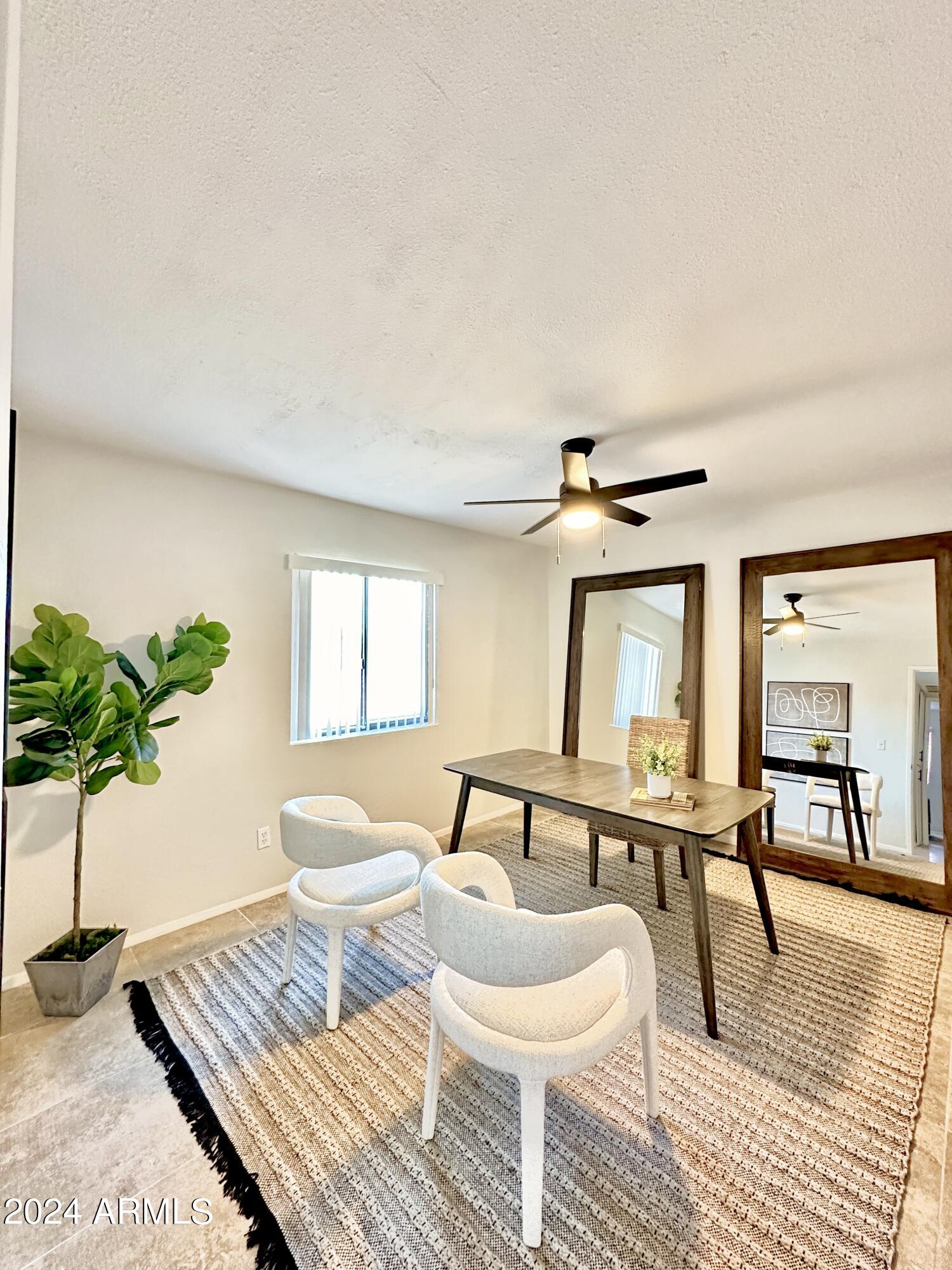1615 North 51st Street, Unit 5 Phoenix, AZ 85008 - Photo 15 of 18 a living room with furniture and a wooden floor