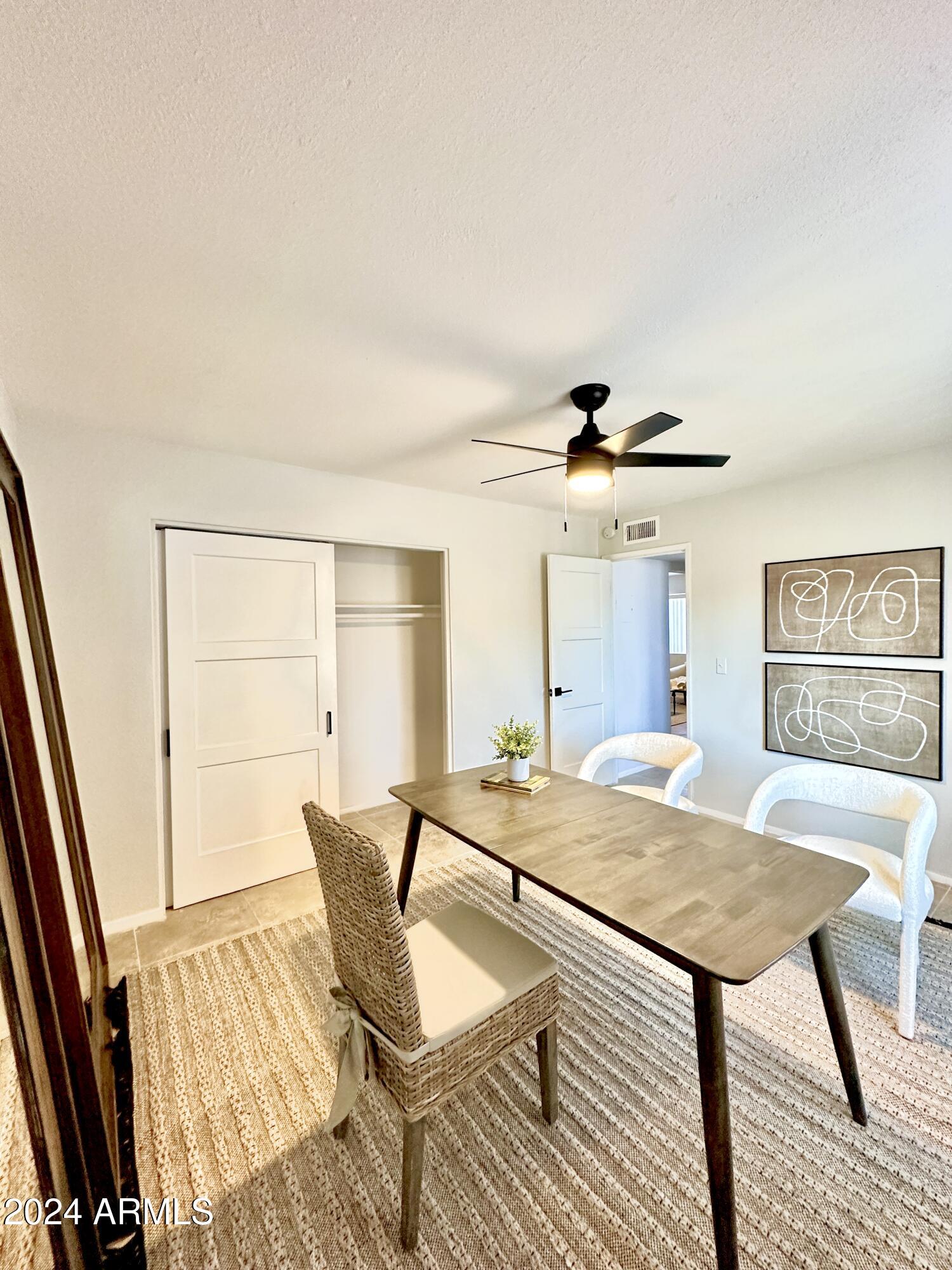 1615 North 51st Street, Unit 5 Phoenix, AZ 85008 - Photo 17 of 18 a view of a livingroom with furniture and a dining table