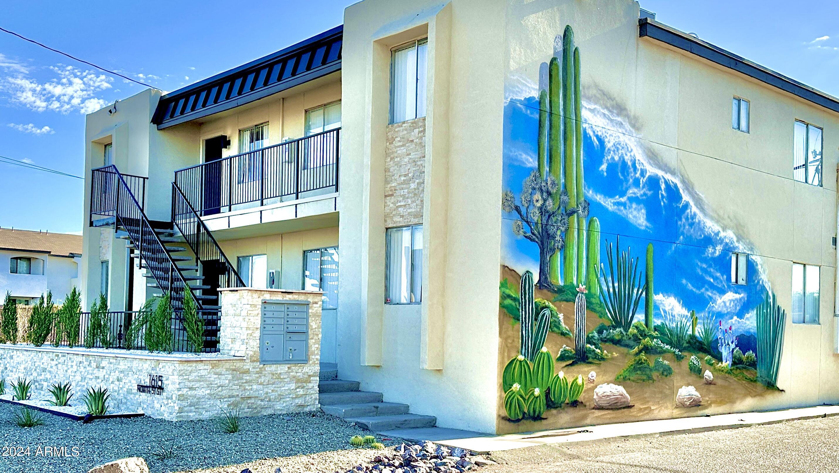 1615 North 51st Street, Unit 5 Phoenix, AZ 85008 - Photo 2 of 18 a front view of a house with a yard
