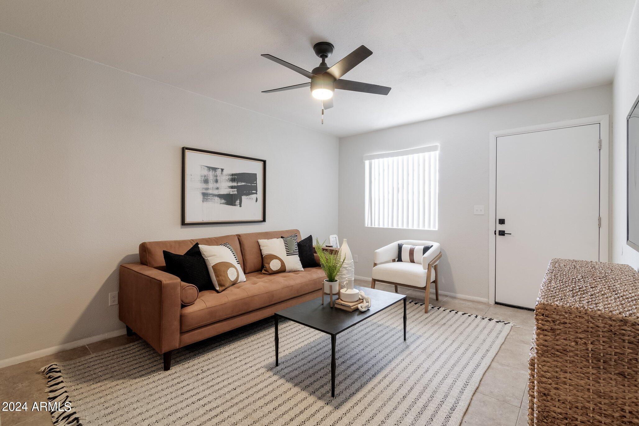 1615 North 51st Street, Unit 5 Phoenix, AZ 85008 - Photo 5 of 18 a living room with furniture and a ceiling fan