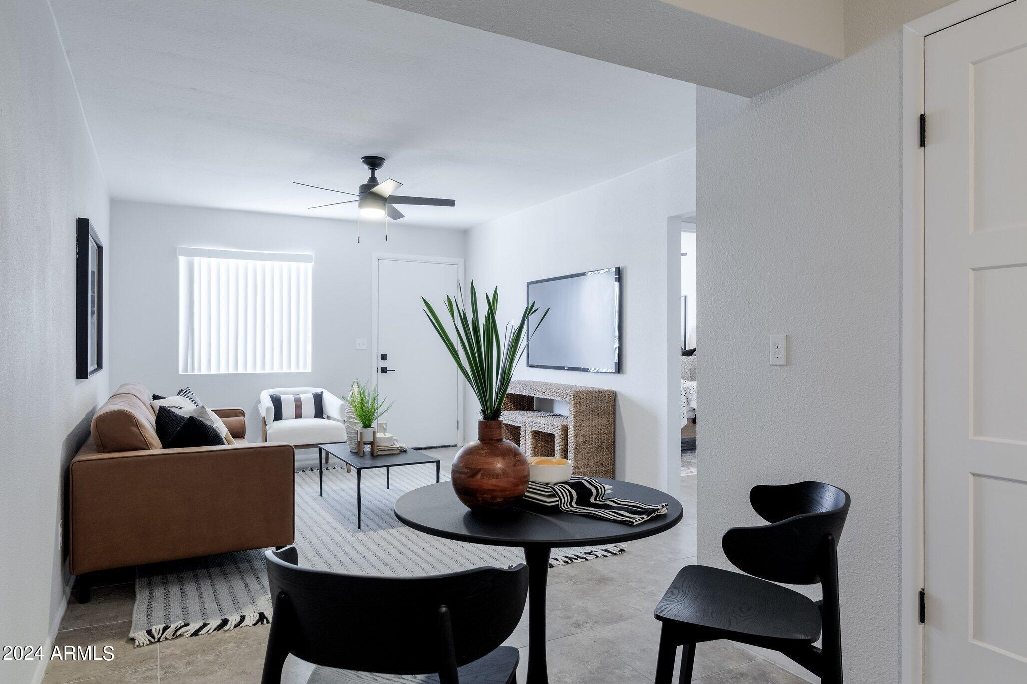 1615 North 51st Street, Unit 5 Phoenix, AZ 85008 - Photo 7 of 18 a living room with furniture potted plant and a window