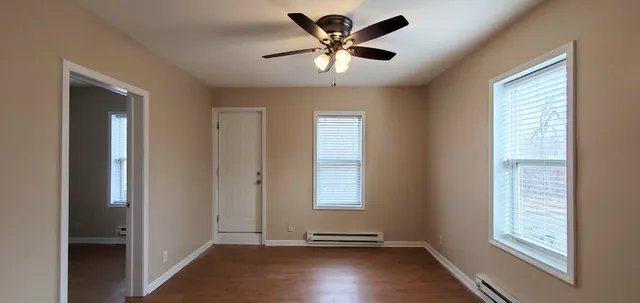 a view of an empty room with a window
