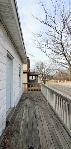 a view of outdoor space with wooden floor