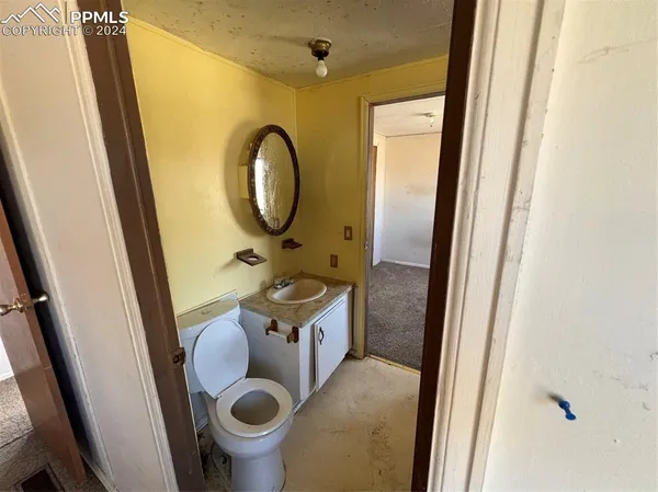 a bathroom with a glass door shower and toilet