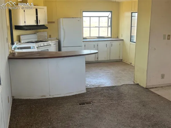 a view of a kitchen with window