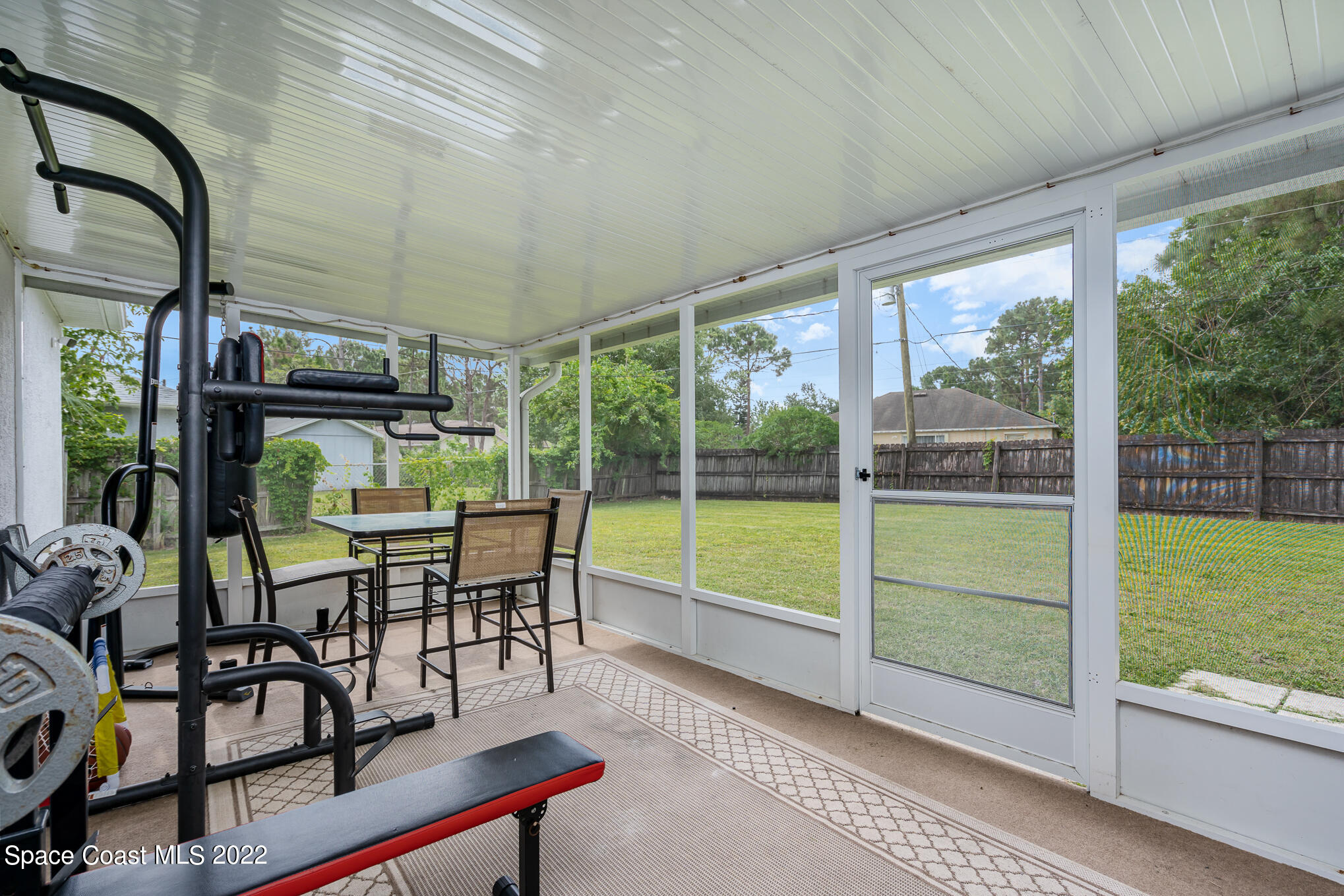 1290 Daton Road Southwest Palm Bay, FL 32908 - Photo 11 of 29 a view of a porch with chairs and backyard