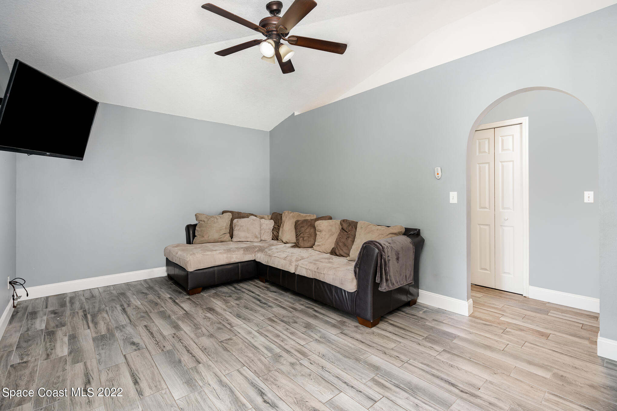 1290 Daton Road Southwest Palm Bay, FL 32908 - Photo 20 of 29 a living room with furniture and a flat screen tv
