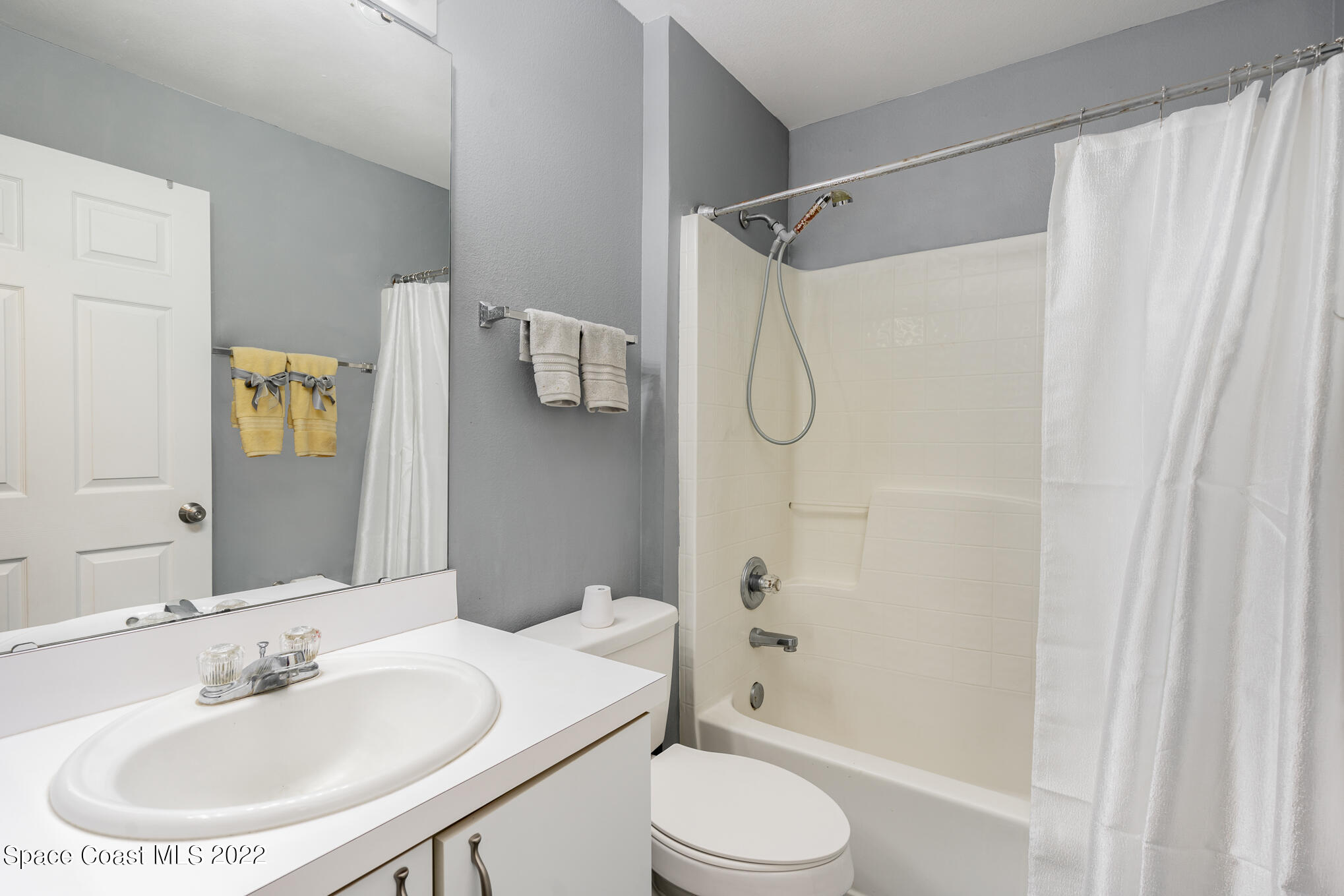 1290 Daton Road Southwest Palm Bay, FL 32908 - Photo 22 of 29 a bathroom with a sink toilet and shower