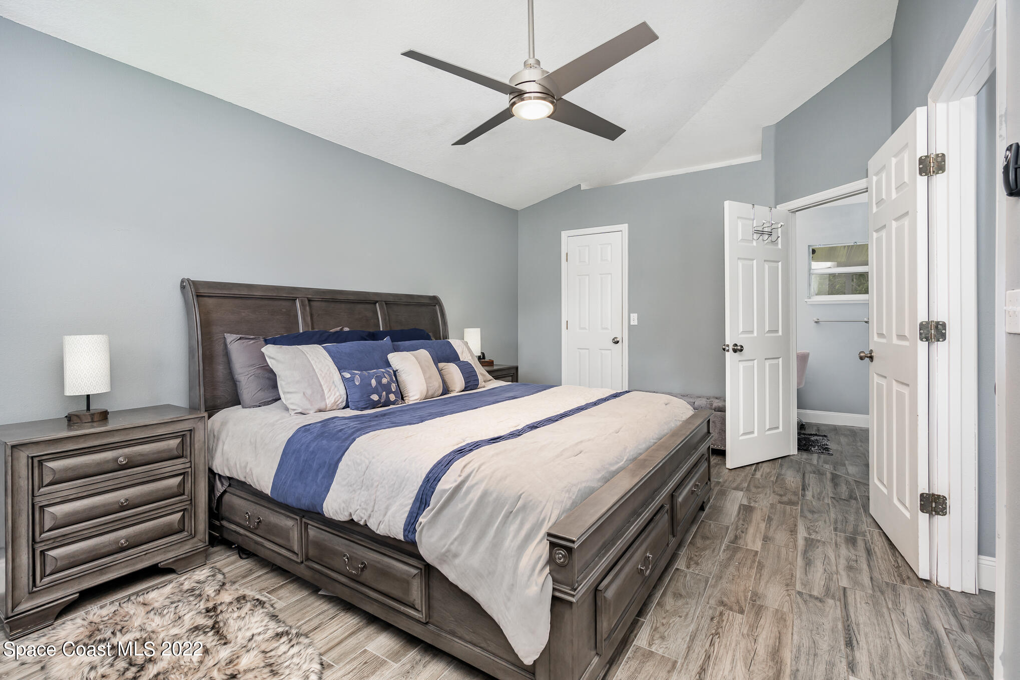 1290 Daton Road Southwest Palm Bay, FL 32908 - Photo 24 of 29 a bedroom with a bed and a ceiling fan