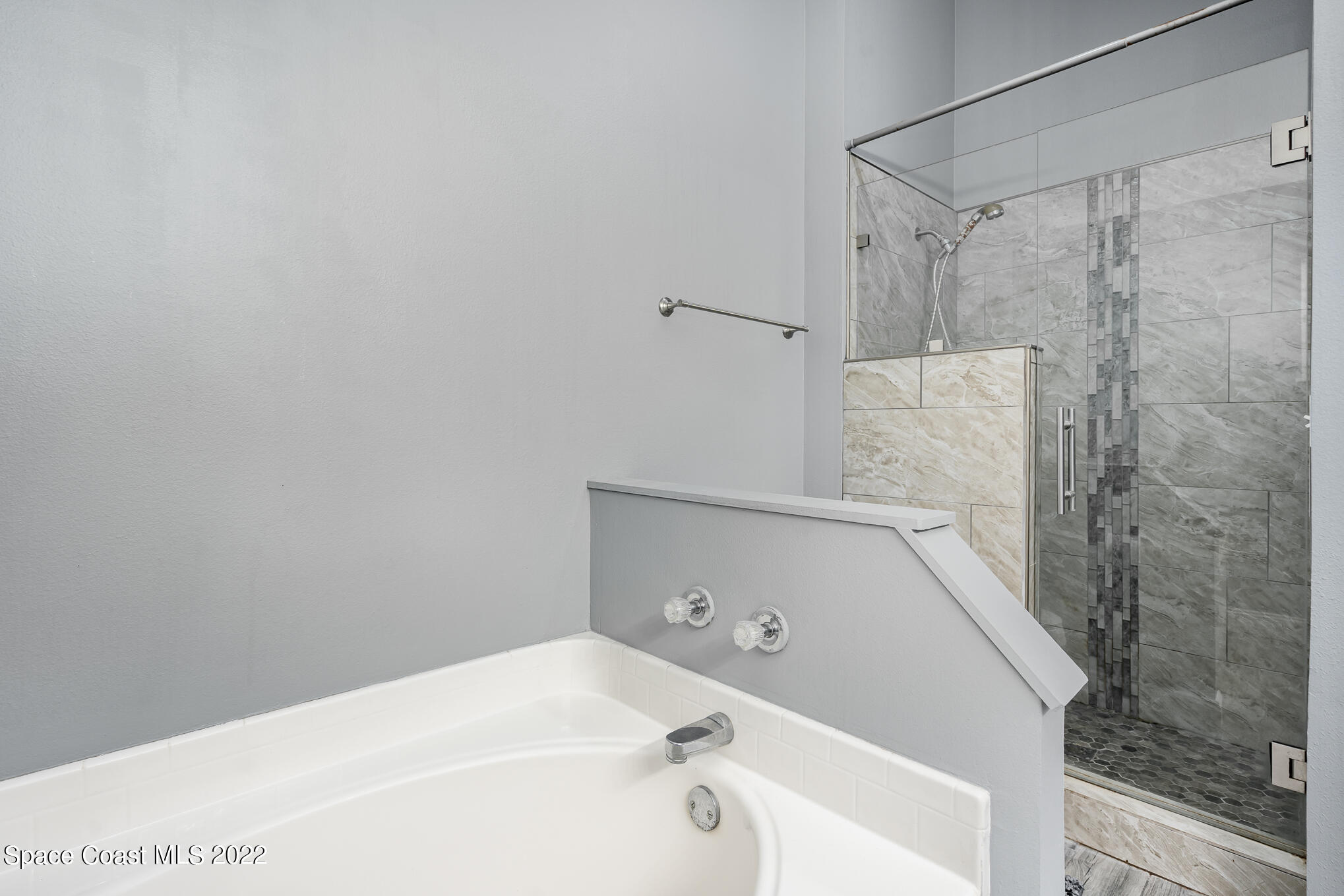 1290 Daton Road Southwest Palm Bay, FL 32908 - Photo 27 of 29 a bathroom with a bathtub and shower