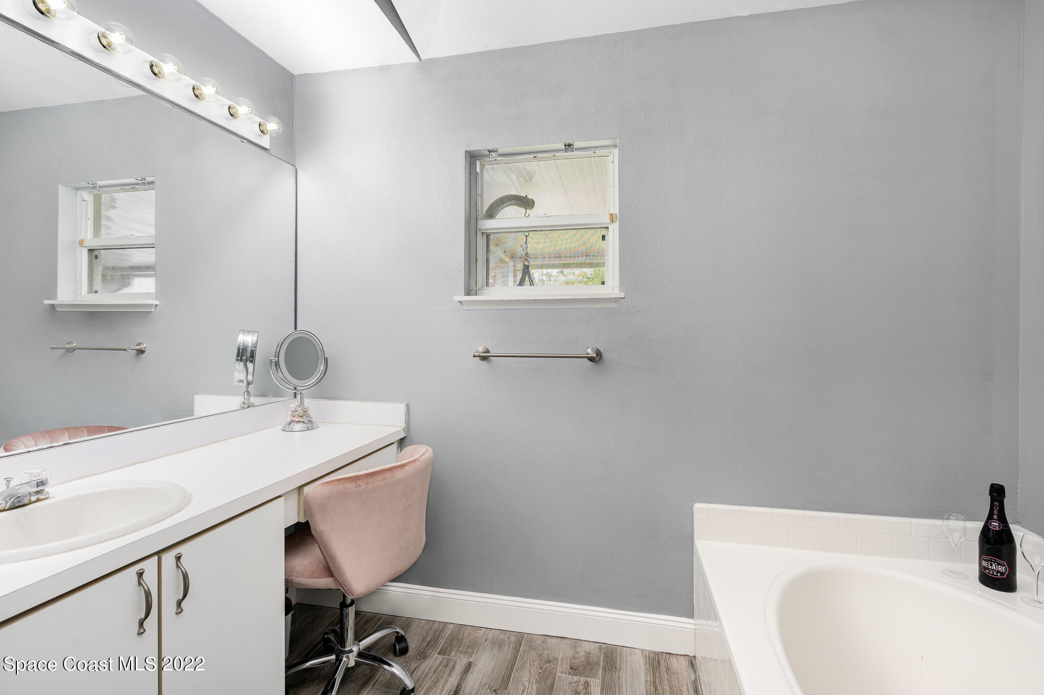 1290 Daton Road Southwest Palm Bay, FL 32908 - Photo 28 of 29 a bathroom with a sink a toilet and mirror