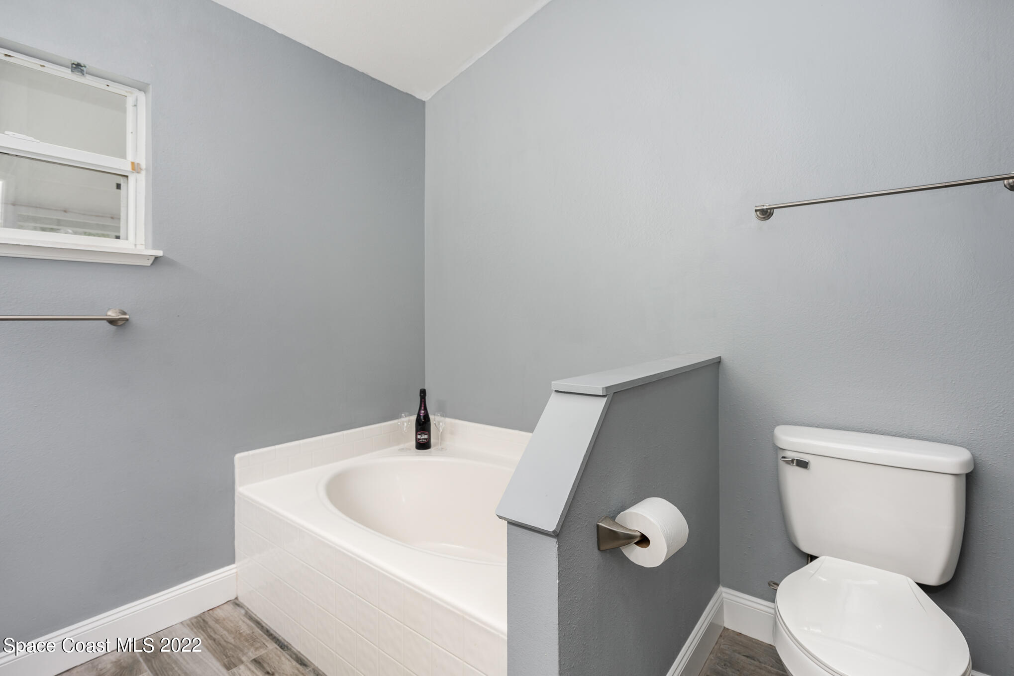 1290 Daton Road Southwest Palm Bay, FL 32908 - Photo 29 of 29 a white toilet sitting next to a bathroom sink