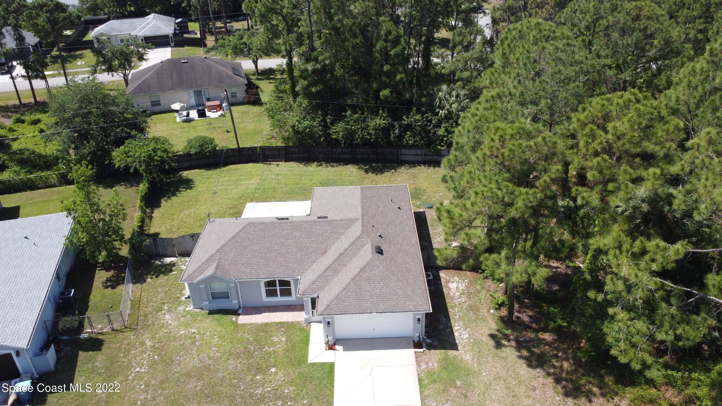 1290 Daton Road Southwest Palm Bay, FL 32908 - Photo 5 of 29 an aerial view of house with yard swimming pool and outdoor seating