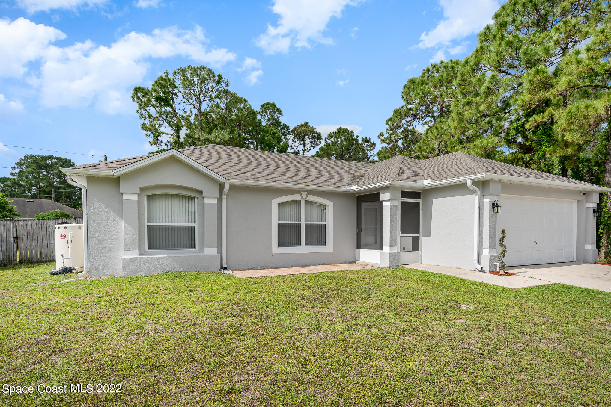 1290 Daton Road Southwest Palm Bay, FL 32908 - Photo 7 of 29 a front view of a house with garden
