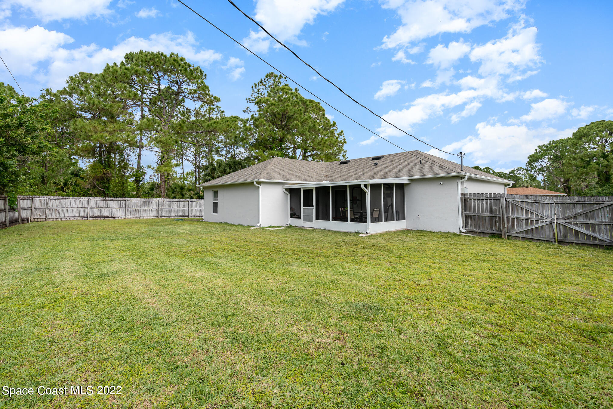 1290 Daton Road Southwest Palm Bay, FL 32908 - Photo 10 of 29 a front view of a house with a garden