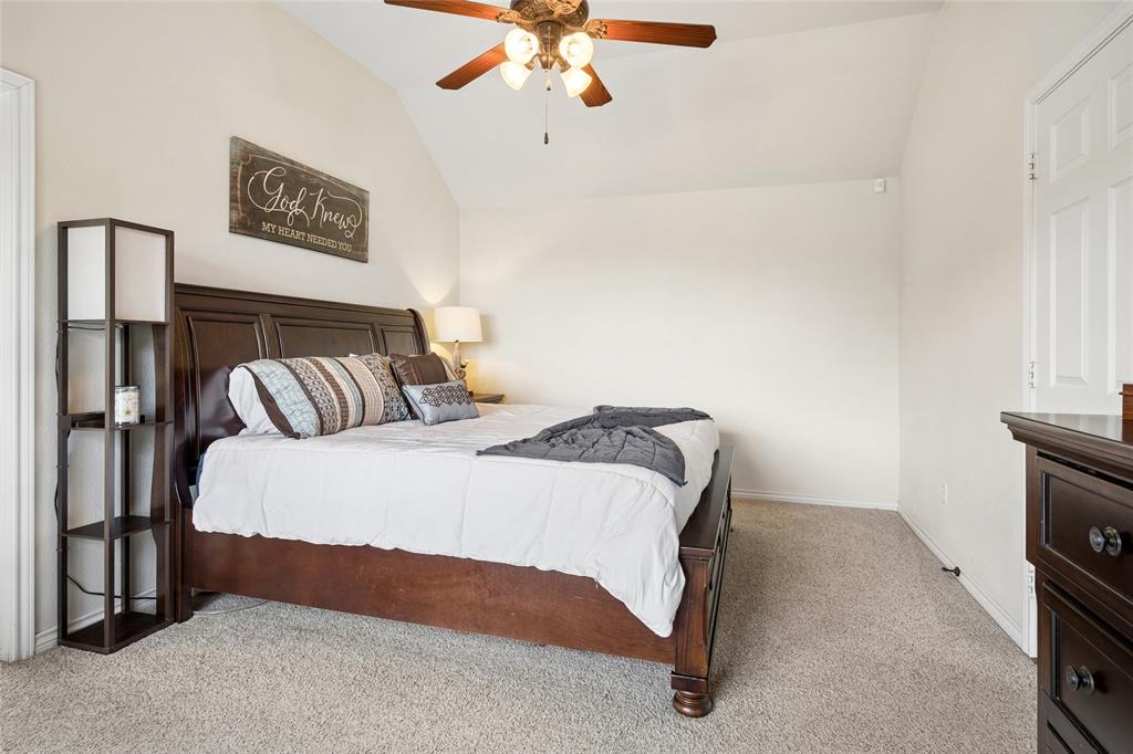 199 Newfield Lane Springtown, TX 76082 - Photo 18 of 38 The room features a vaulted ceiling, light-colored walls, and carpeting