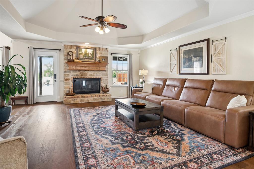 199 Newfield Lane Springtown, TX 76082 - Photo 10 of 38 Wood burning fireplace compliments this cozy den.