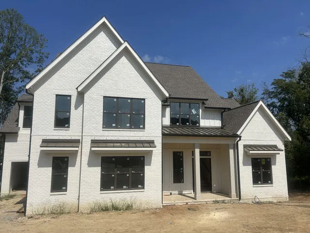 a front view of a house with a garage
