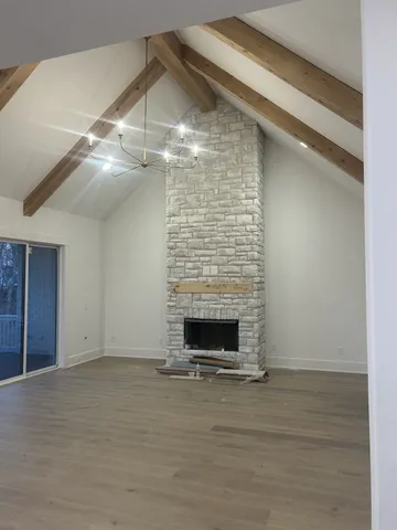 a view of fireplace and wooden floor