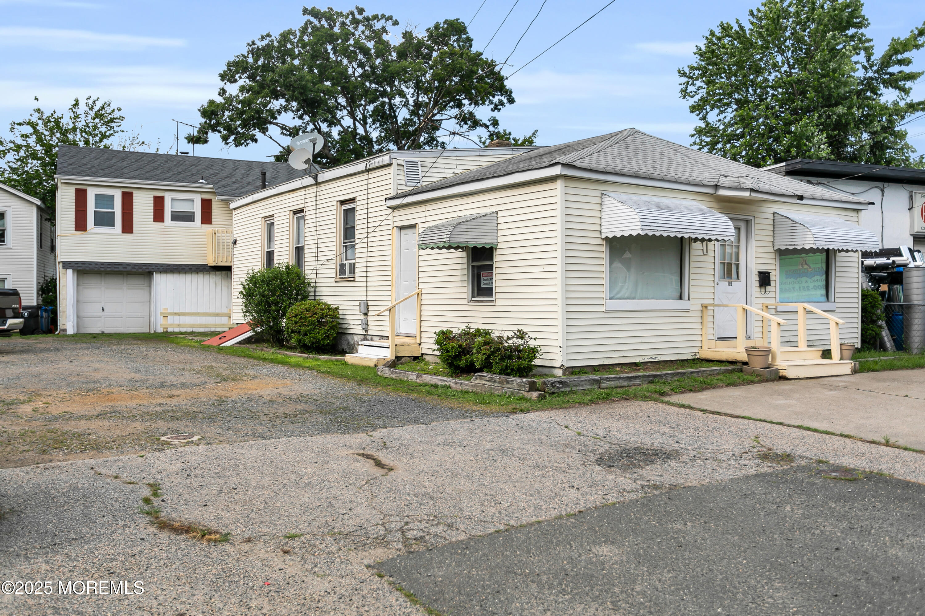 a front view of a house with a yard and a garage