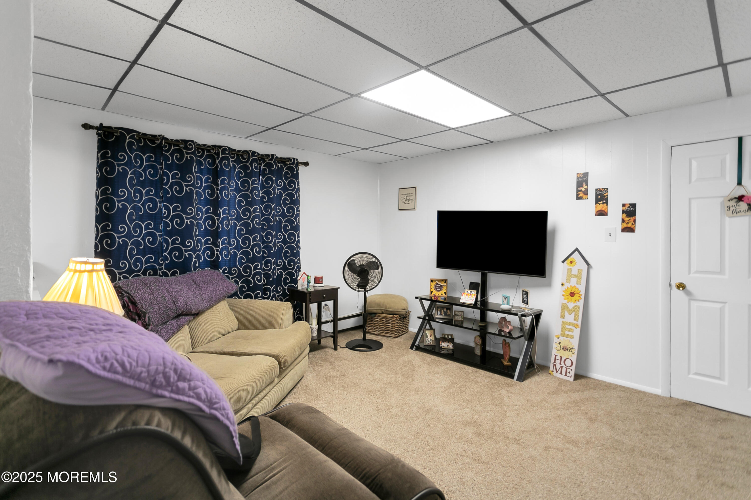 289 Port Monmouth Road North Middletown, NJ 07748 - Photo 11 of 37 a living room with furniture and a flat screen tv