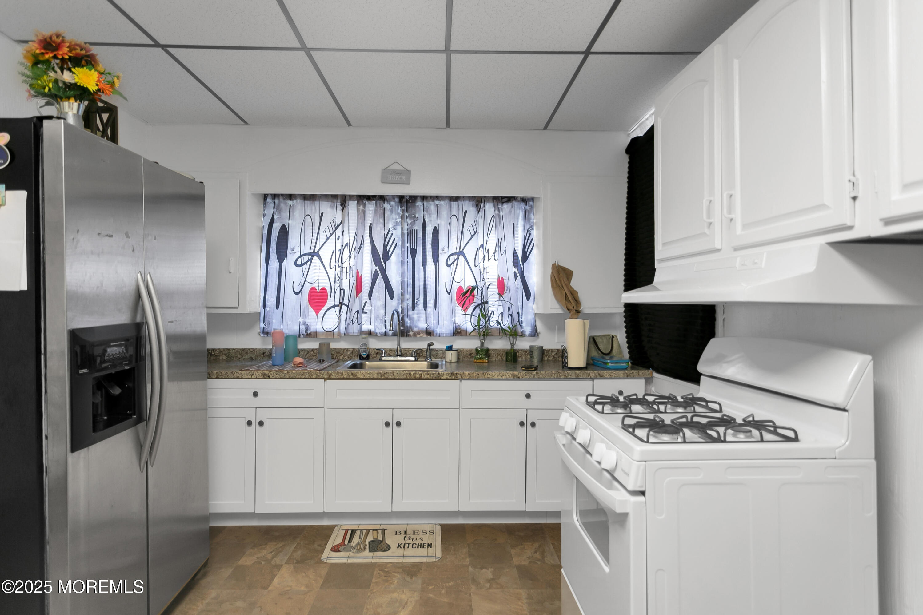 289 Port Monmouth Road North Middletown, NJ 07748 - Photo 17 of 37 a kitchen with stainless steel appliances a stove a refrigerator and a cabinets