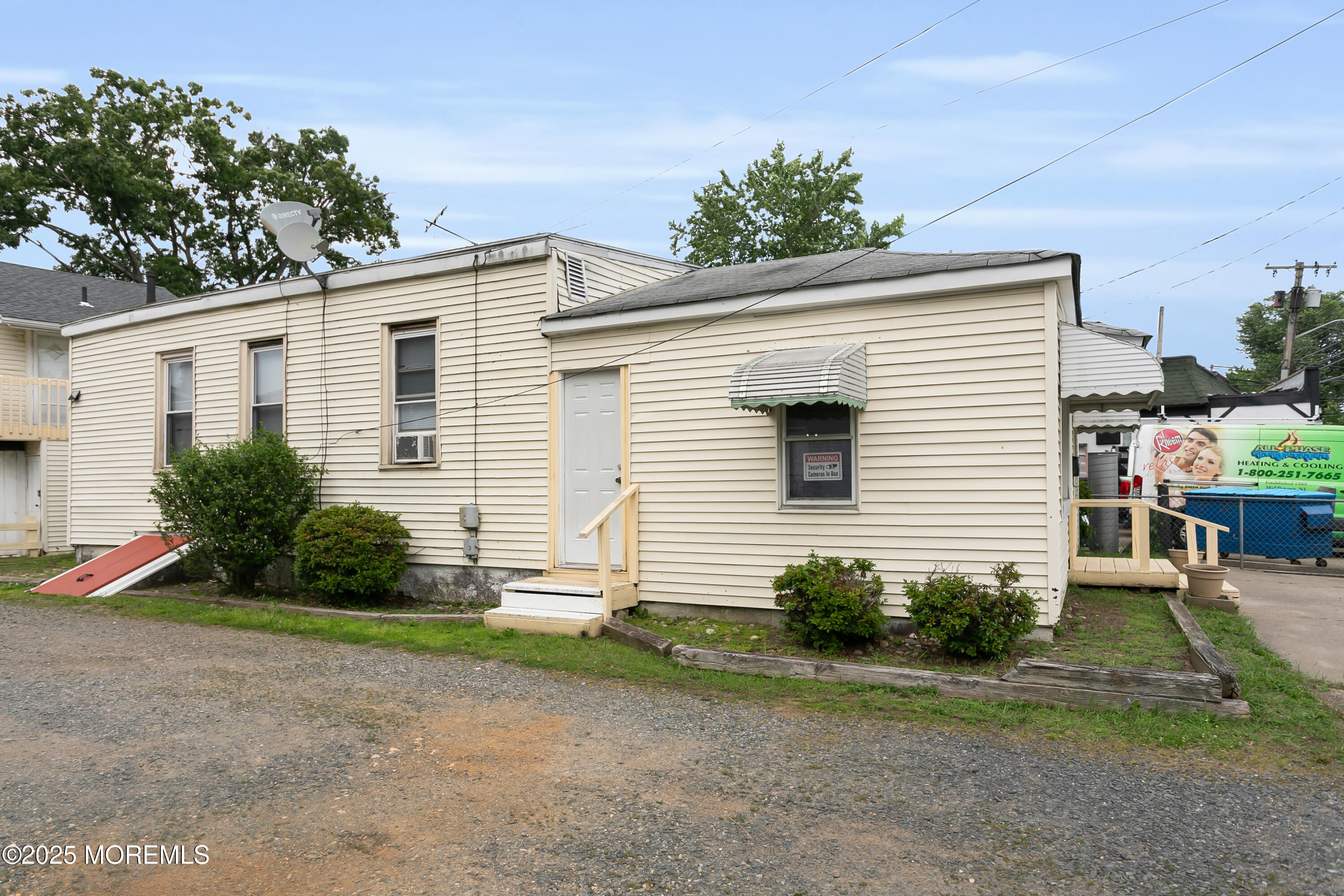 289 Port Monmouth Road North Middletown, NJ 07748 - Photo 2 of 37 a view of a house with a yard and plants