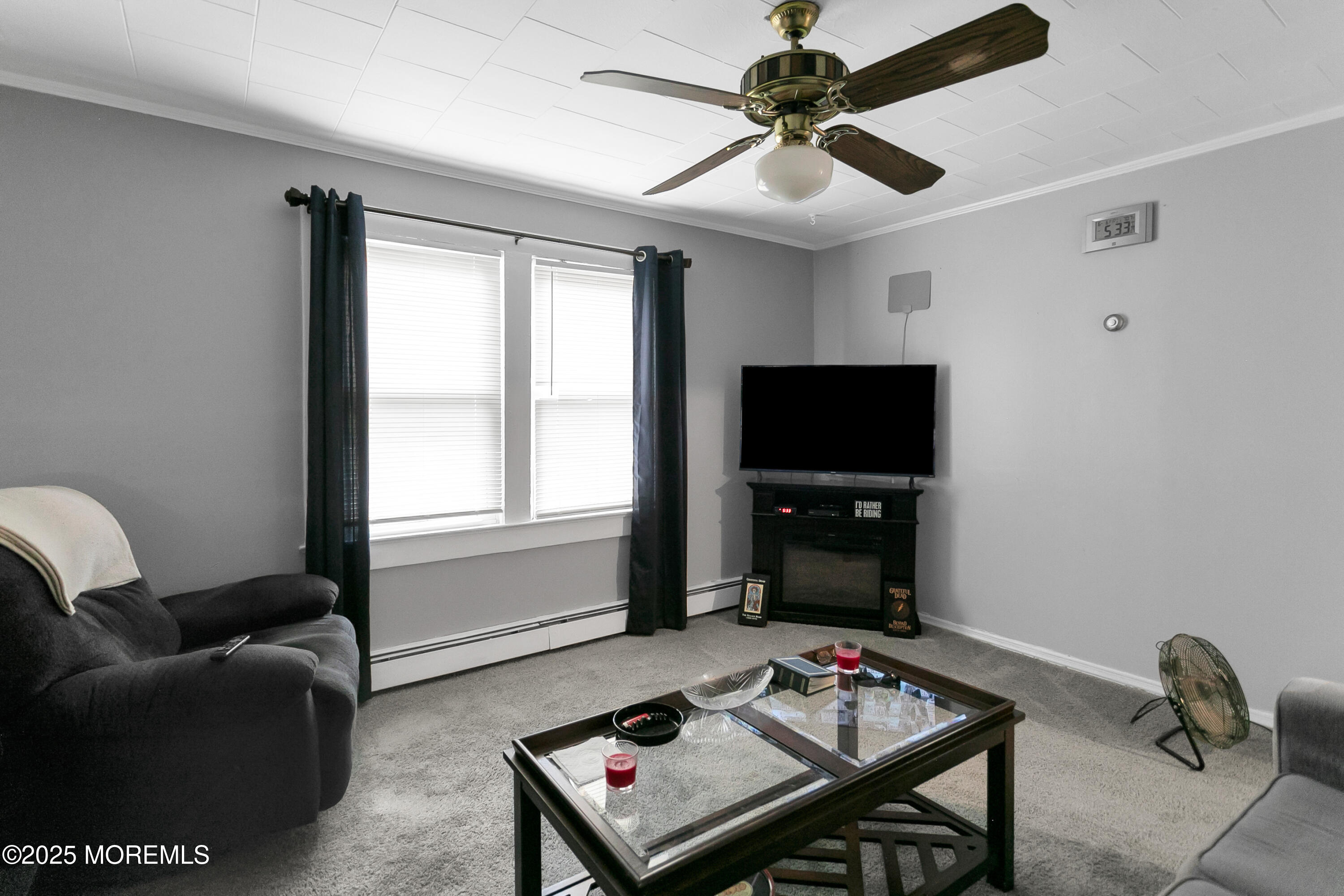 289 Port Monmouth Road North Middletown, NJ 07748 - Photo 27 of 37 a living room with furniture and a flat screen tv