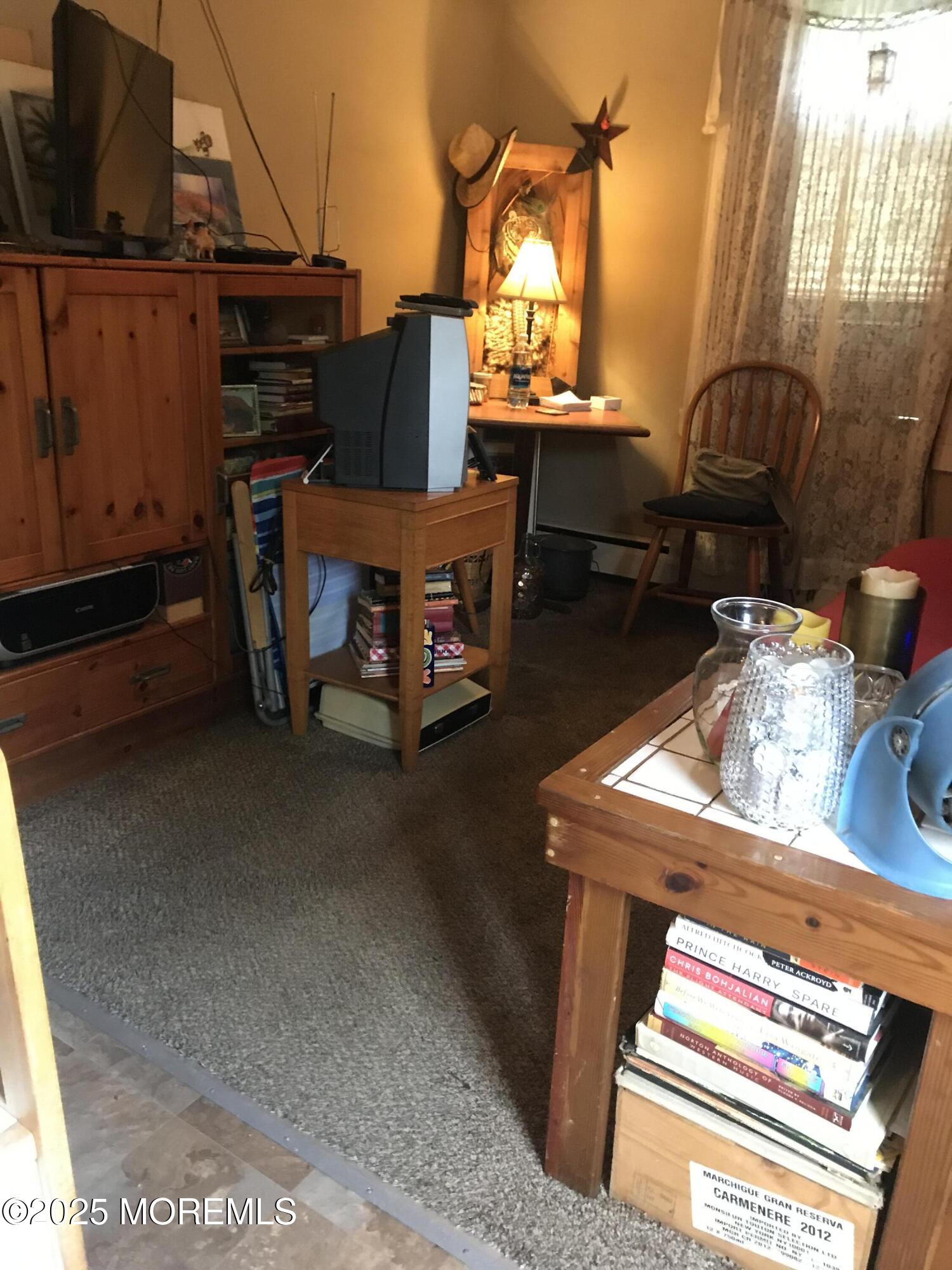 289 Port Monmouth Road North Middletown, NJ 07748 - Photo 36 of 37 a view of a chairs and table in the back