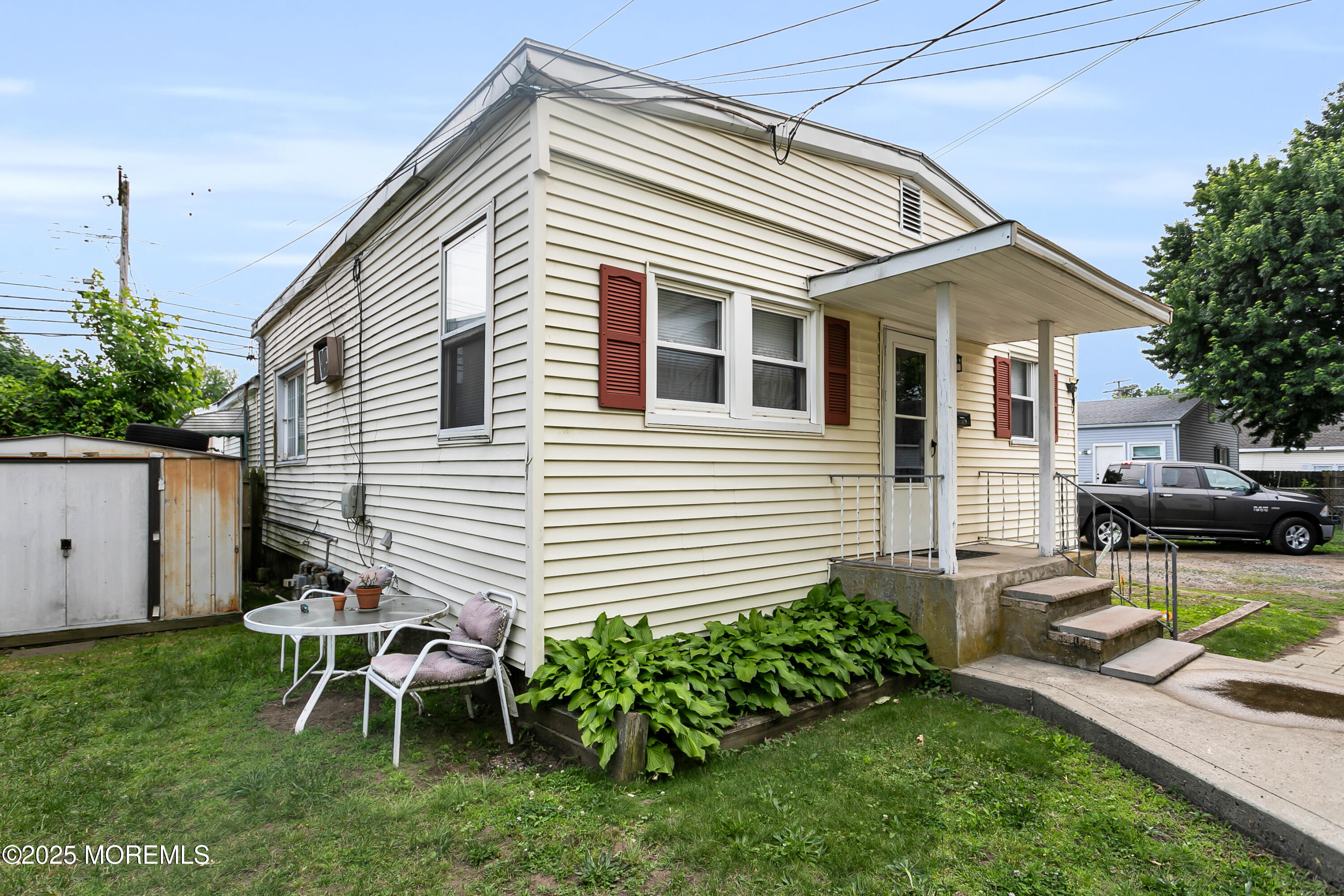 289 Port Monmouth Road North Middletown, NJ 07748 - Photo 8 of 37 a backyard of a house with table and chairs