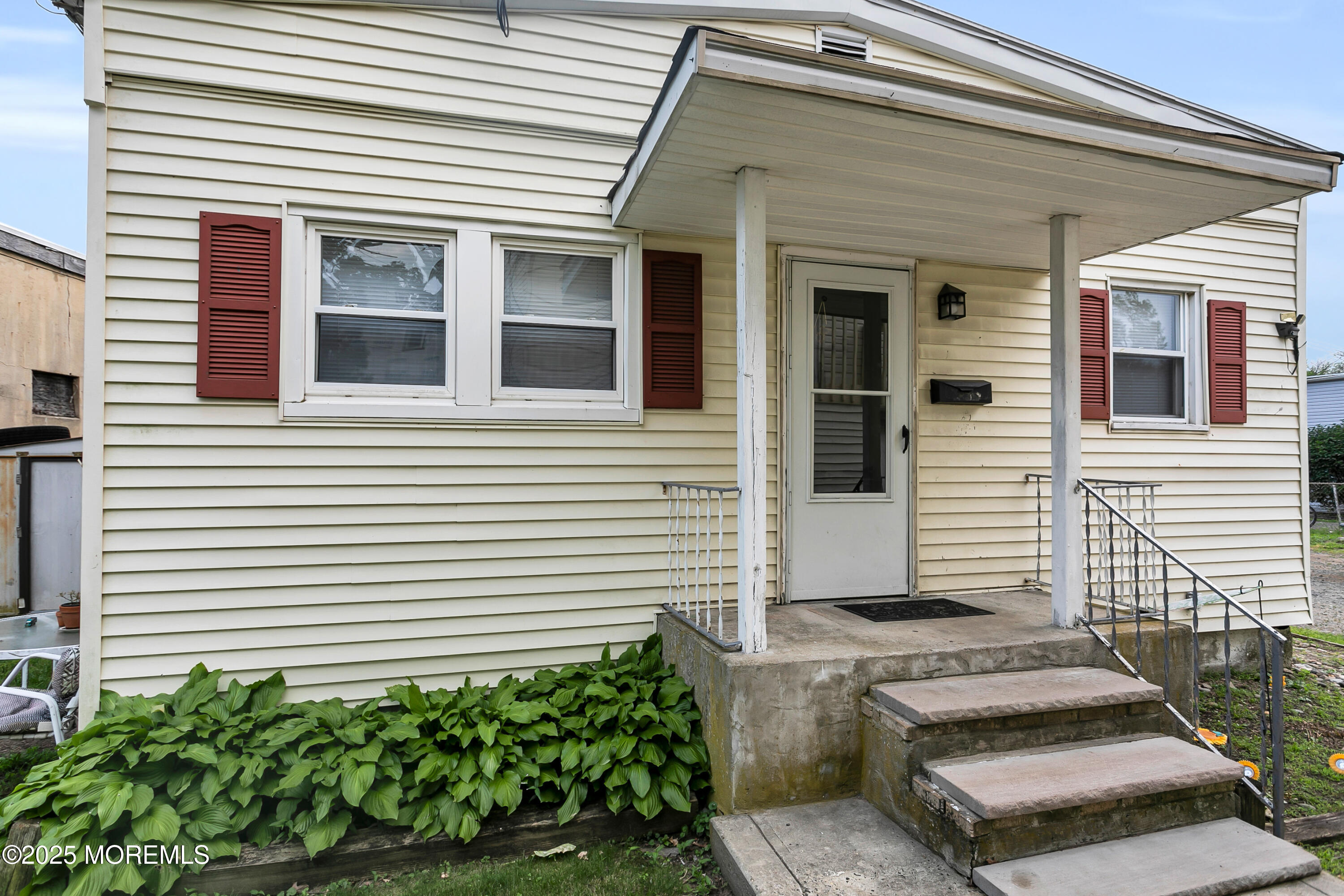 289 Port Monmouth Road North Middletown, NJ 07748 - Photo 9 of 37 a view of a house with a door and a potted plant