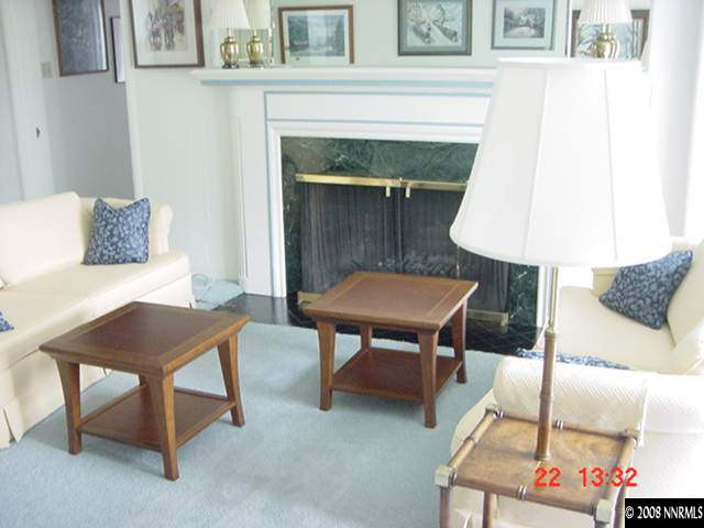205 Urban Road Reno, NV 89509 - Photo 4 of 9 a living room with furniture and a fireplace