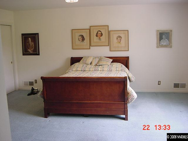 205 Urban Road Reno, NV 89509 - Photo 6 of 9 a bedroom with a bed and a dresser
