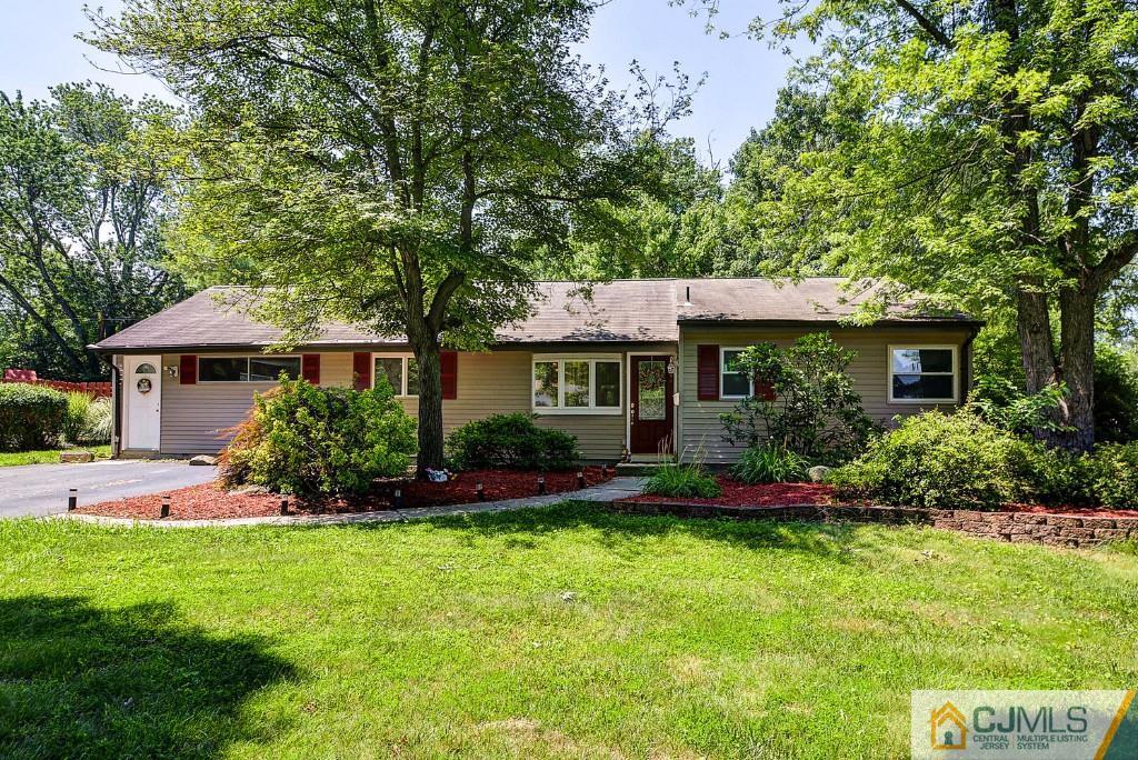 85 Kendall Road Kendall Park, NJ 08824 - Photo 1 of 25 a front view of a house with a yard