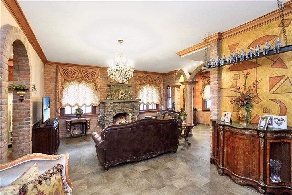 1406 73rd Street Brooklyn, NY 11228 - Photo 12 of 42 a living room with furniture a fireplace and large windows