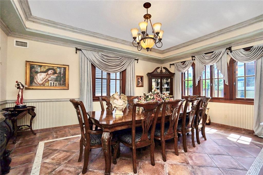 1406 73rd Street Brooklyn, NY 11228 - Photo 19 of 42 a view of a dining room with furniture a chandelier and wooden floor