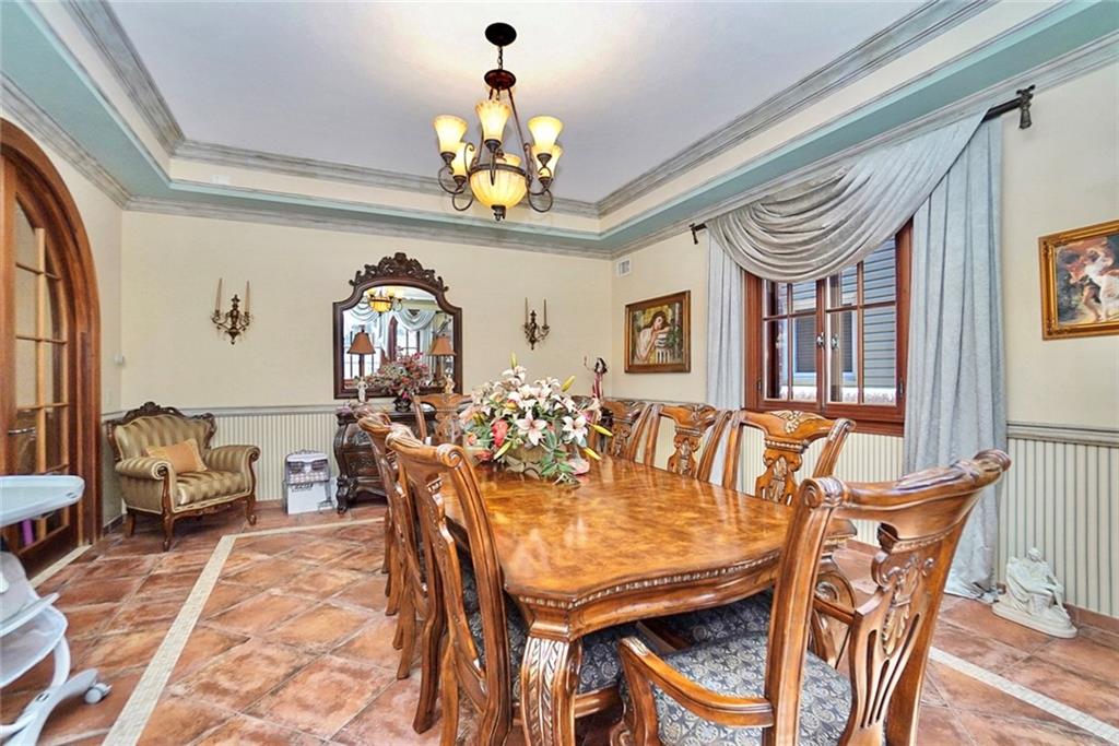 1406 73rd Street Brooklyn, NY 11228 - Photo 20 of 42 a view of a dining room with furniture and chandelier