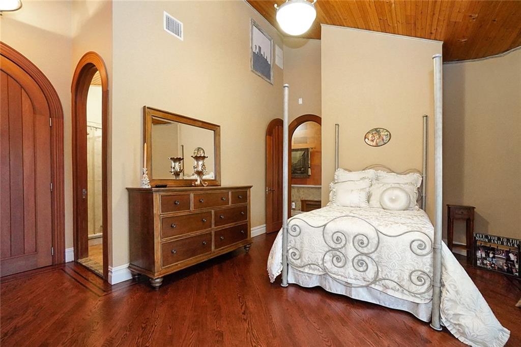 1406 73rd Street Brooklyn, NY 11228 - Photo 26 of 42 a bedroom with bed and wooden floor