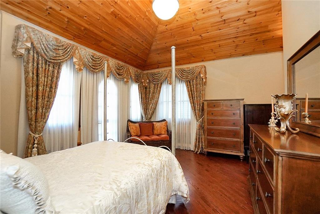 1406 73rd Street Brooklyn, NY 11228 - Photo 28 of 42 a bedroom with furniture and wooden floor